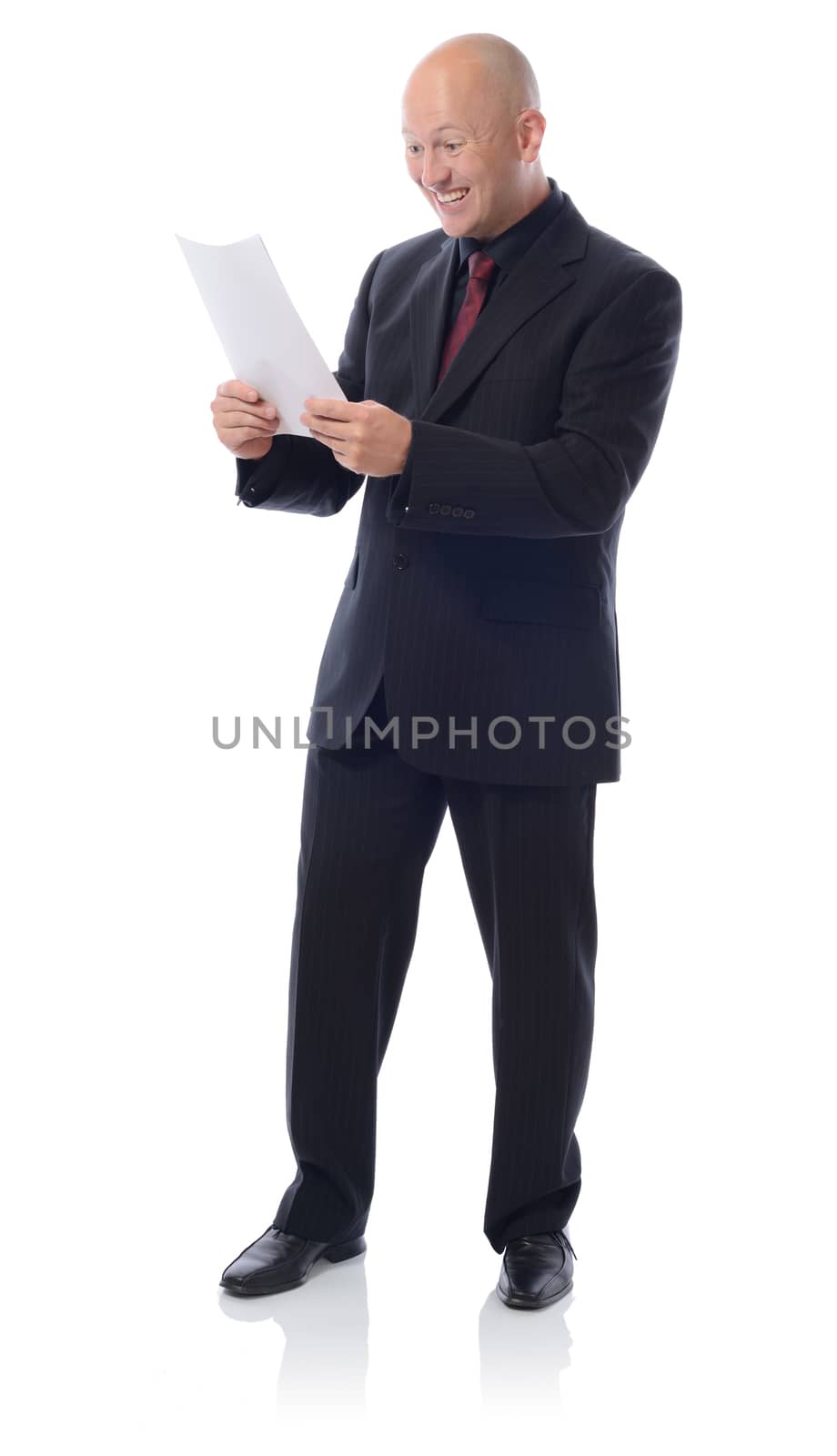 Man in suit with a letter reciving good result or news isolated on white