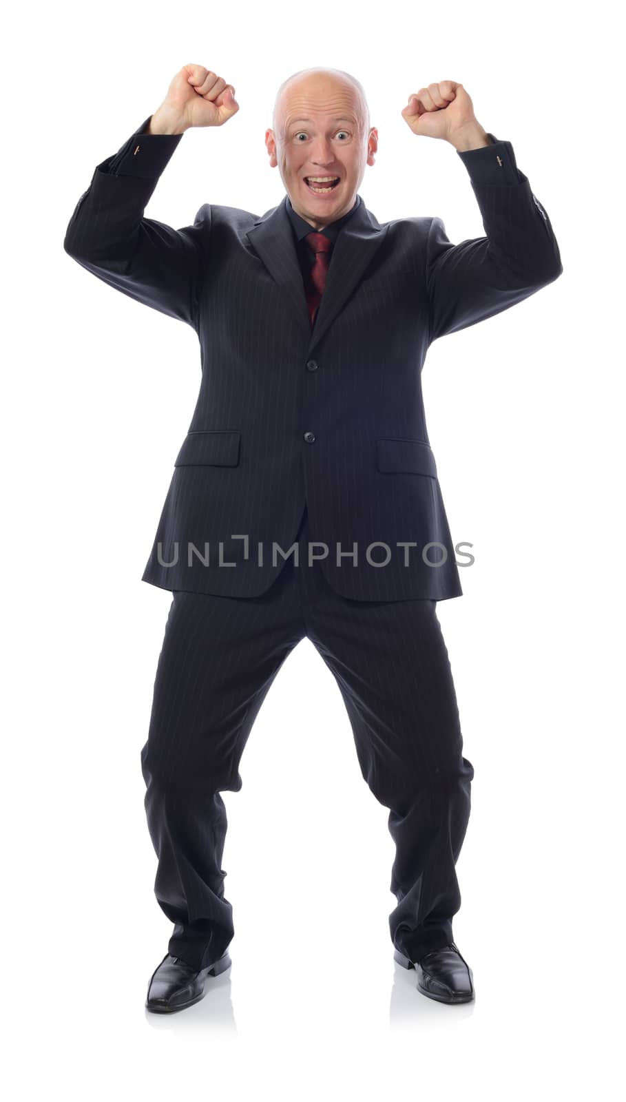 man in suit winning with arms in the air isolated on white