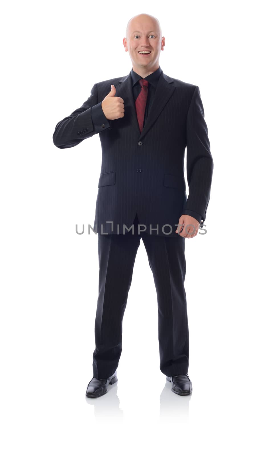 smiling man in suit gesturing thumbs up sign isolated on white
