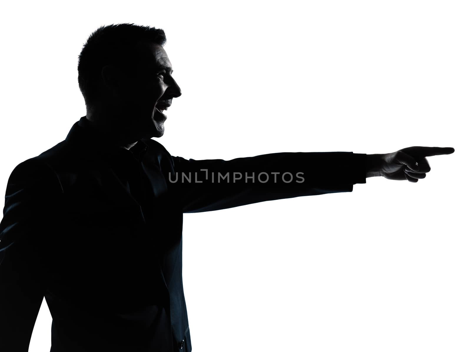 one caucasian business man pointing portrait silhouette in studio isolated on white background
