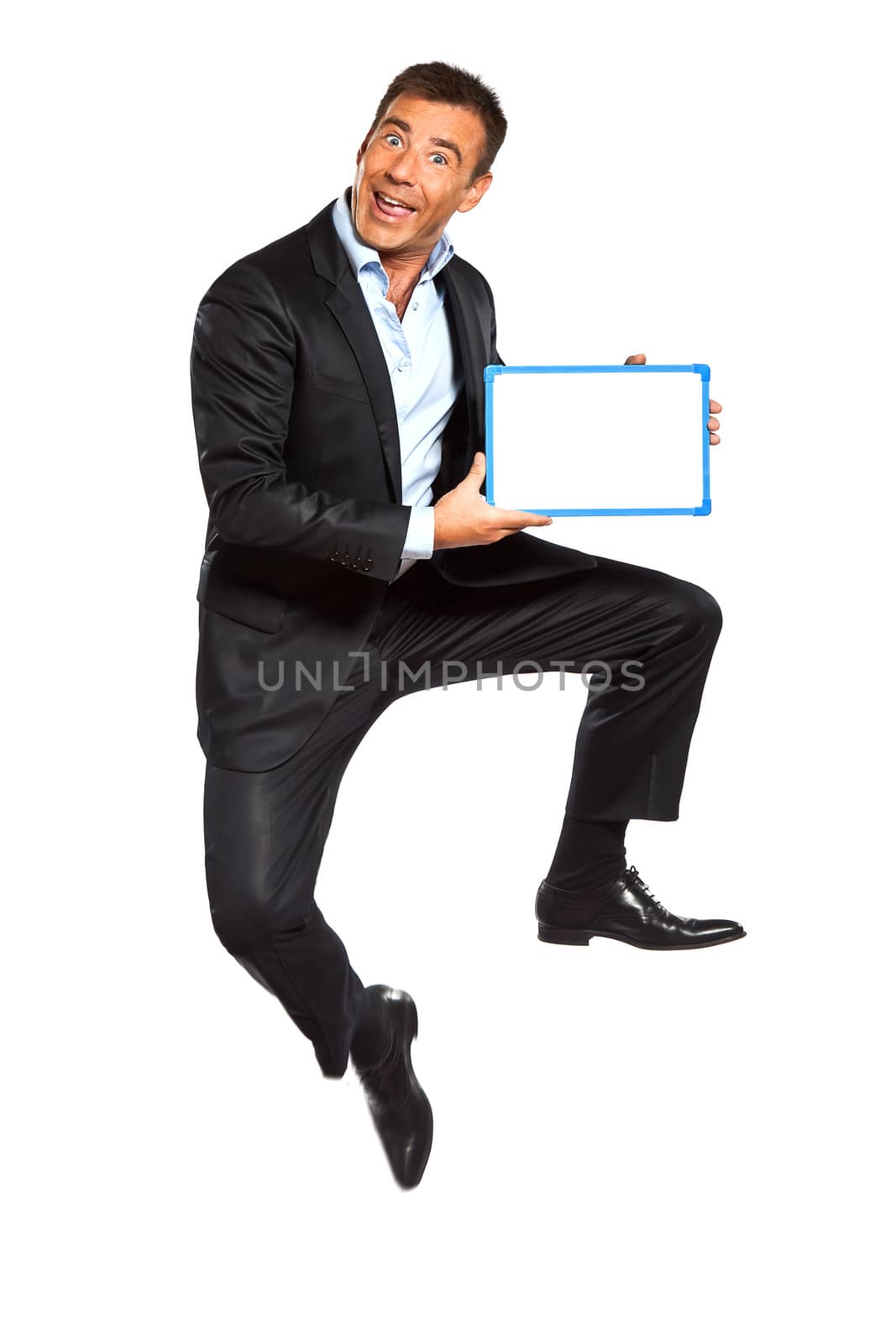 one caucasian business man  jumping holding showing whiteboard in studio isolated on white background