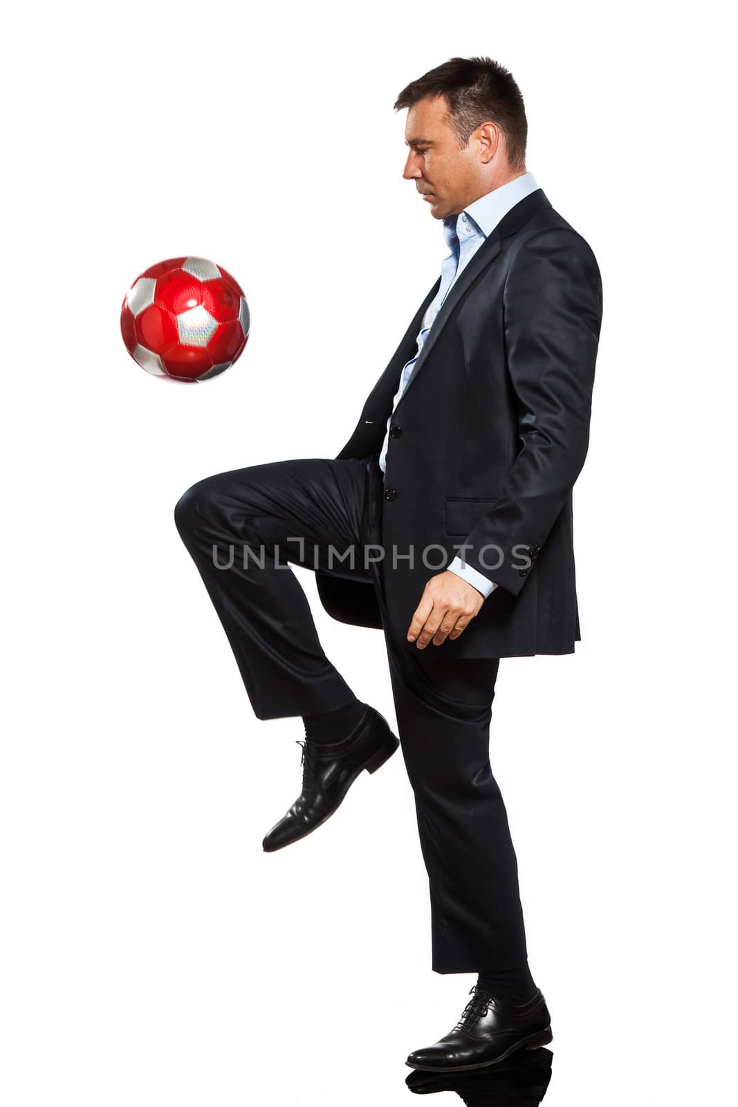 one business man playing juggling soccer ball by PIXSTILL