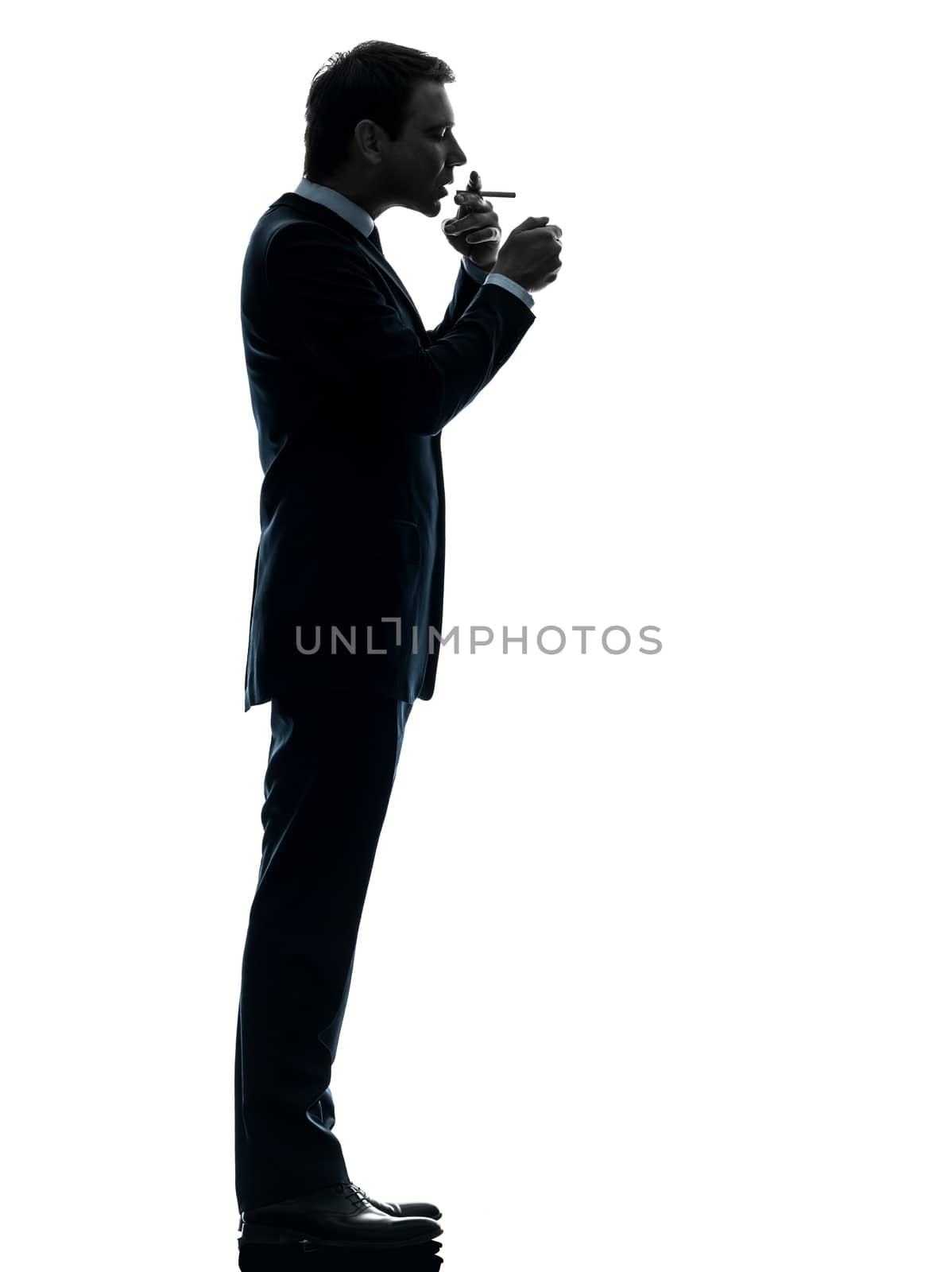 one caucasian man smoking cigarette  in silhouette studio isolated on white background