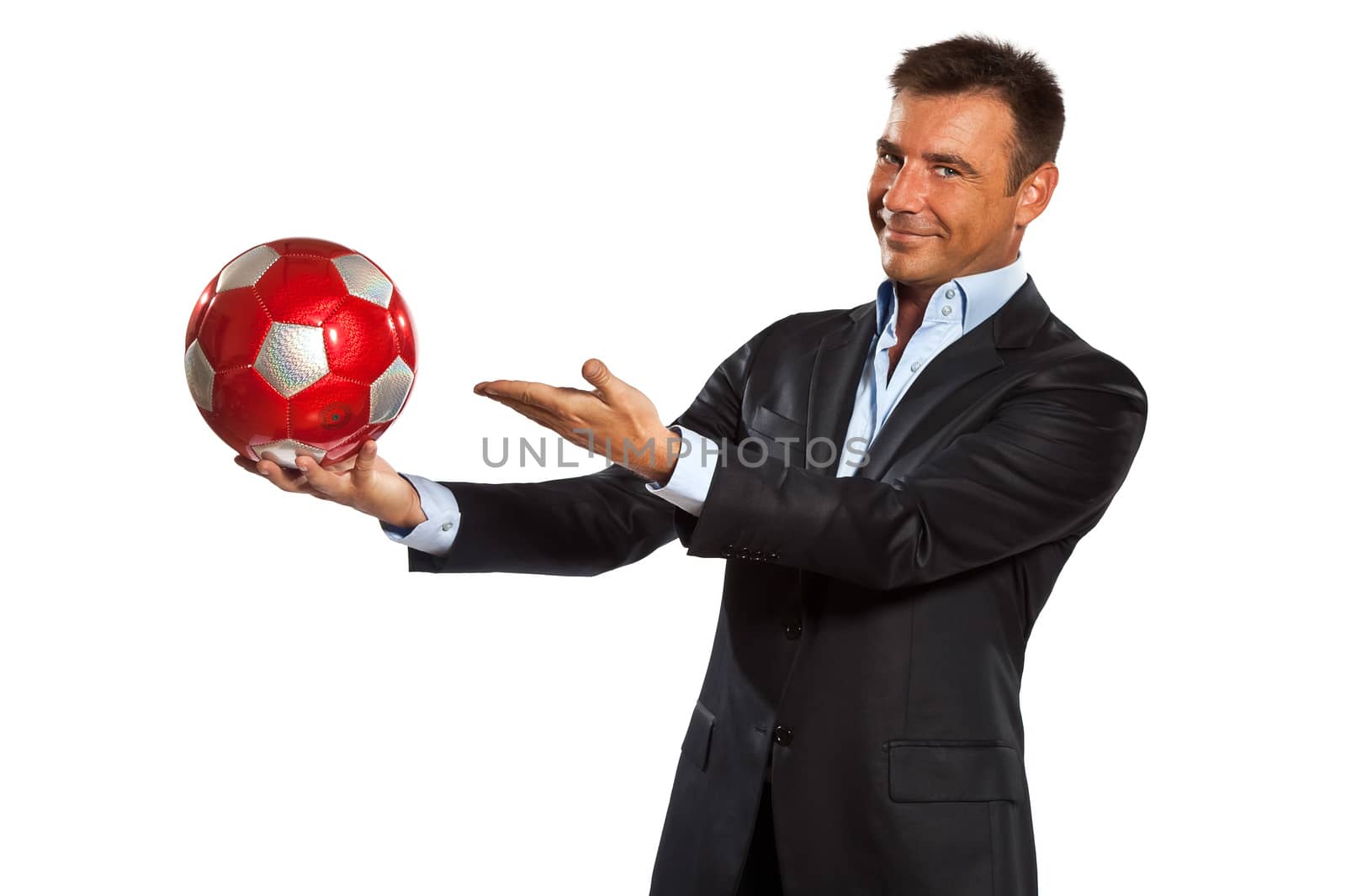 one caucasian business man holding showing soccer ball in studio isolated on white background