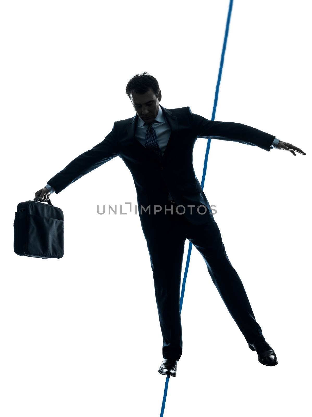 Businessman  tightrope walker silhouette by PIXSTILL