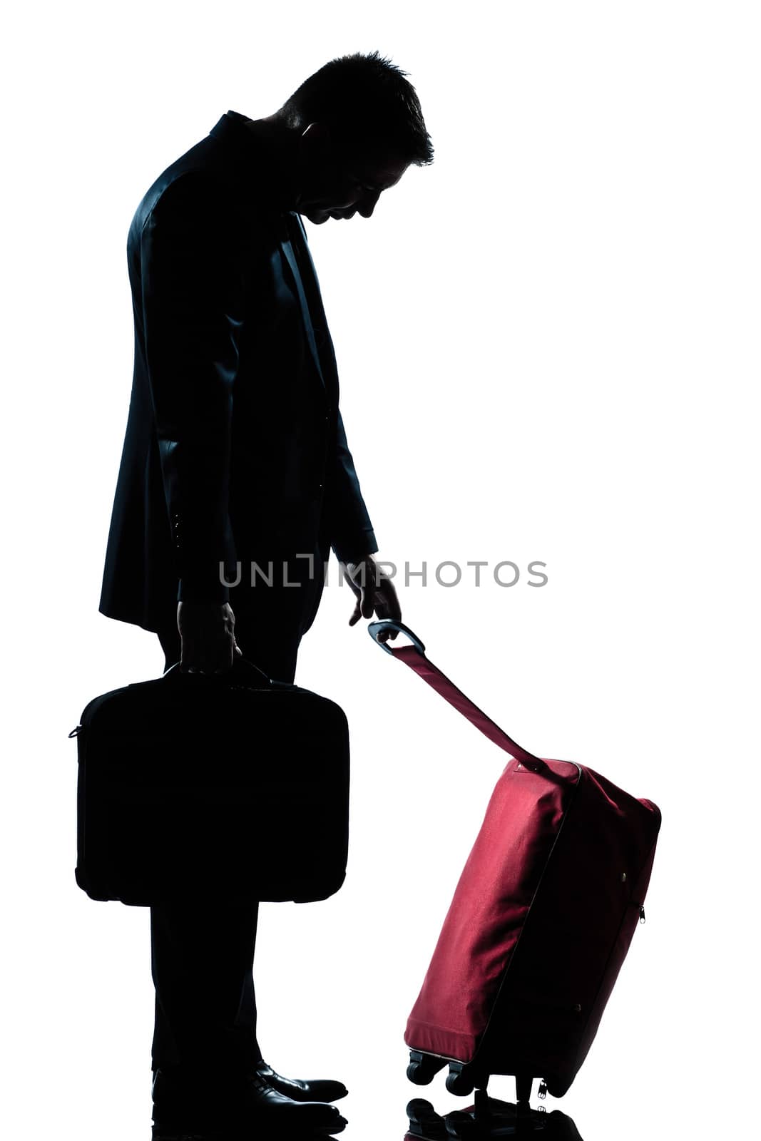 caucasian business traveler man tired with suitcase   by PIXSTILL