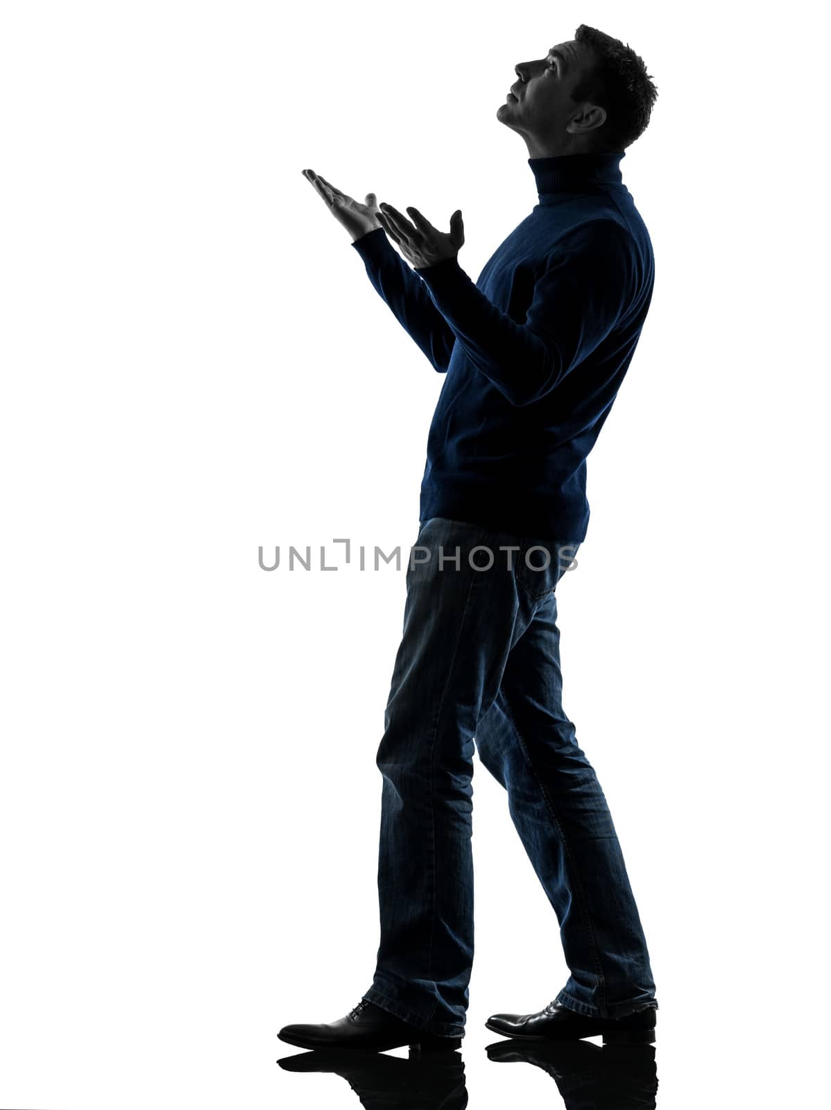 one caucasian man looking up happy  full length in silhouette studio isolated on white background