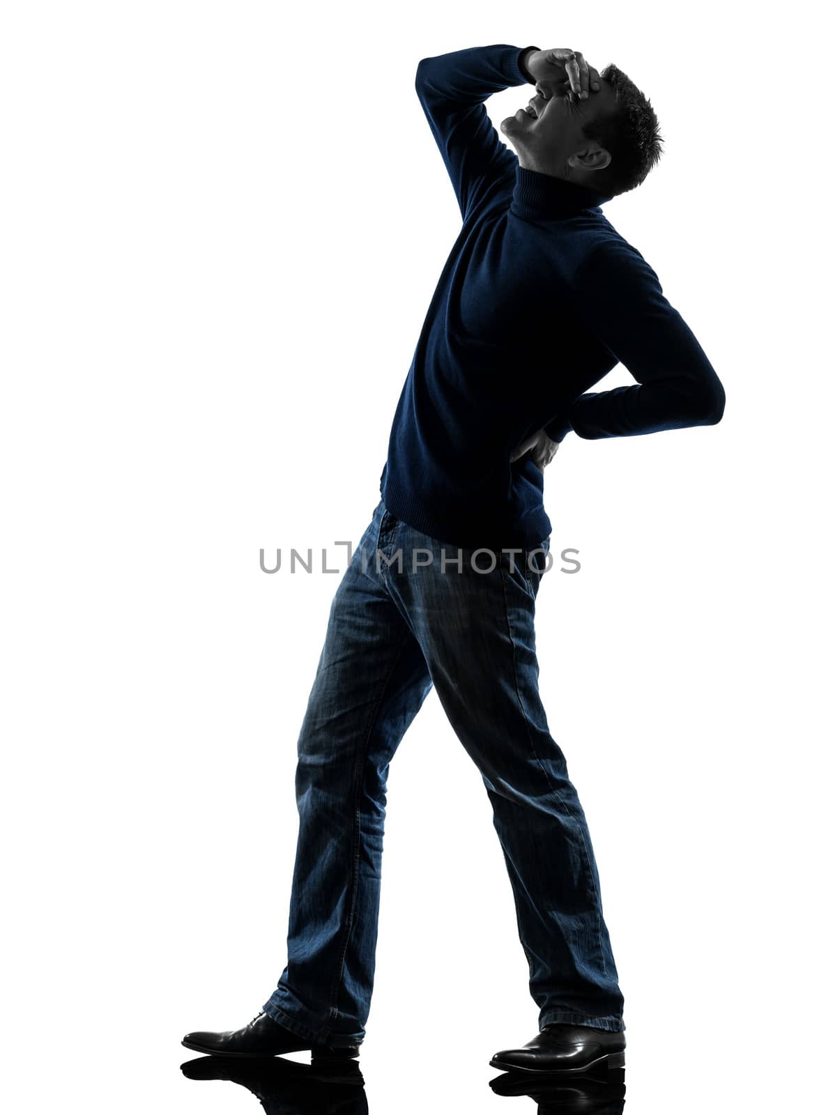 one caucasian man full length in silhouette studio isolated on white background