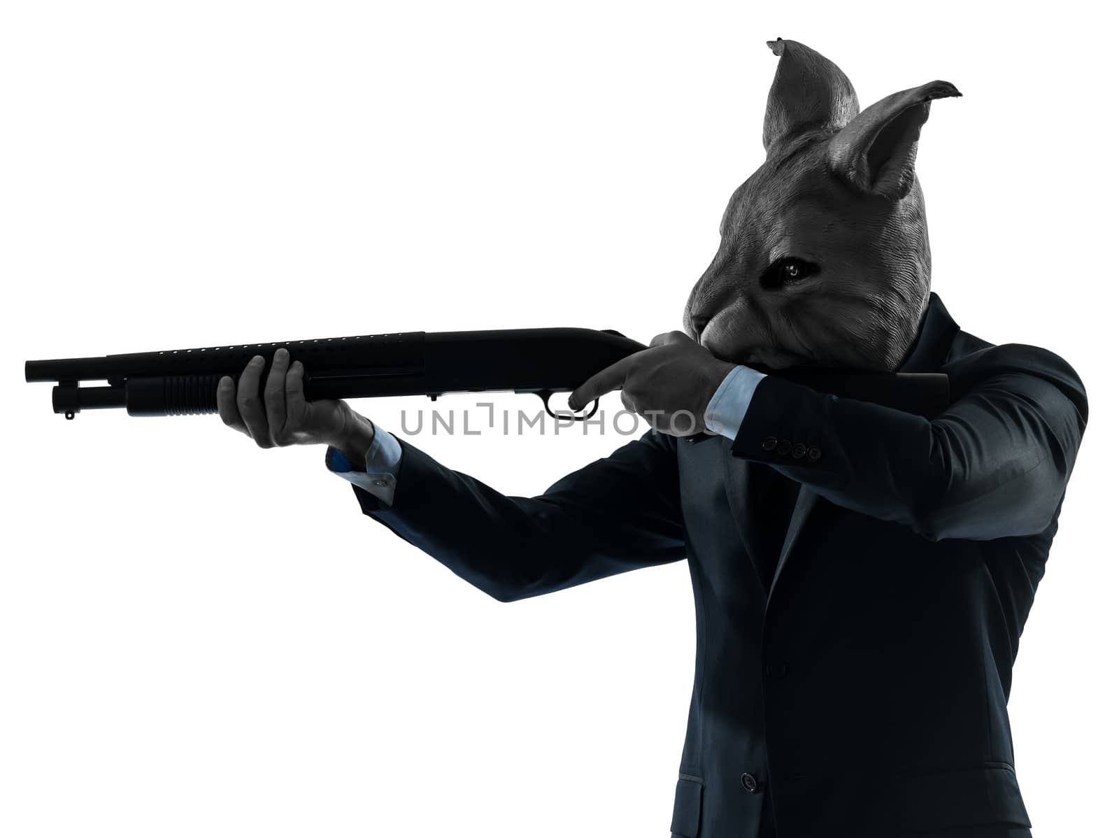 one caucasian man rabbit mask hunting with shotgun portrait in silhouette studio isolated on white background