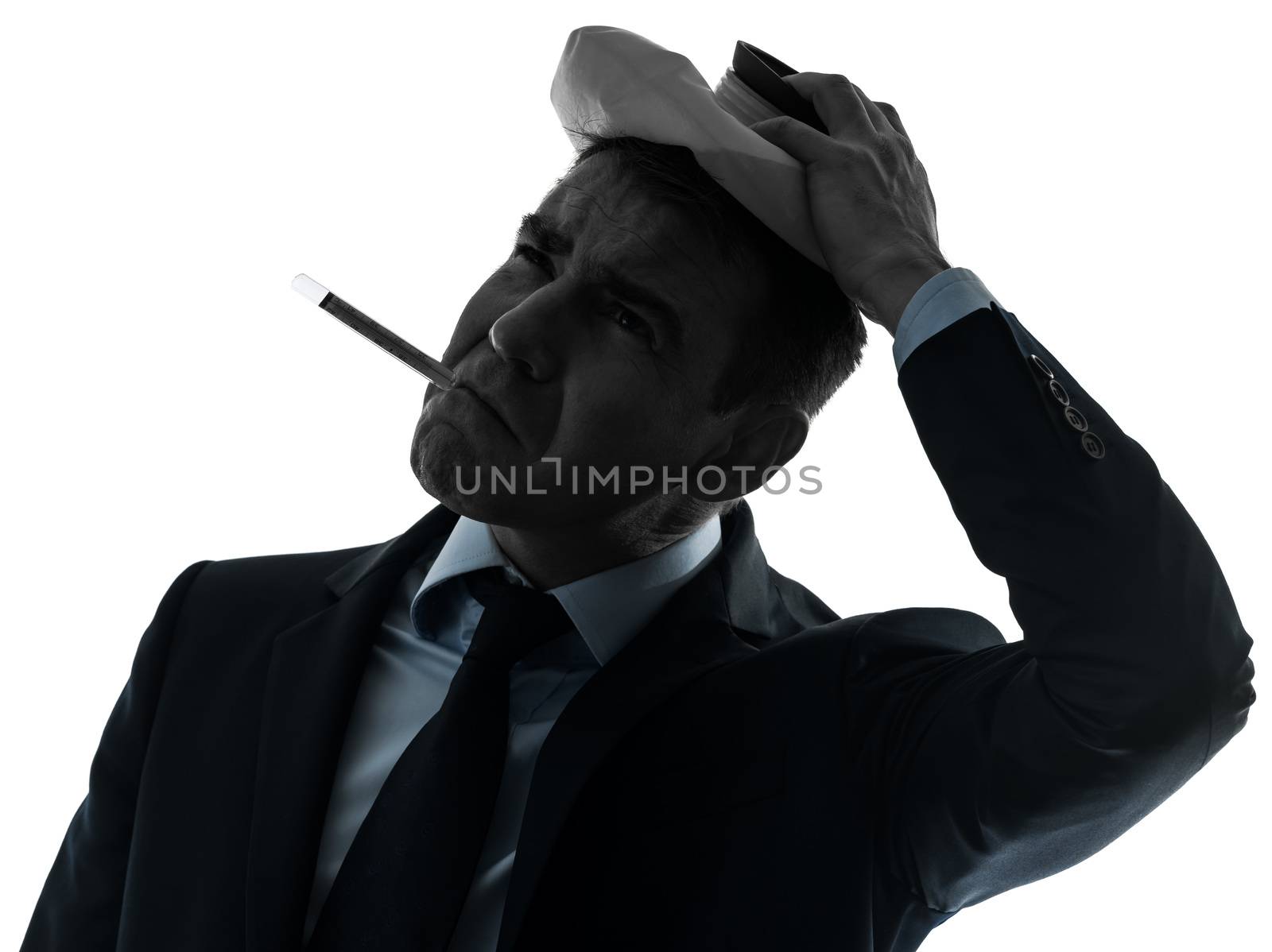 one caucasian man sick with thermometer and ice pack  portrait in silhouette studio isolated on white background