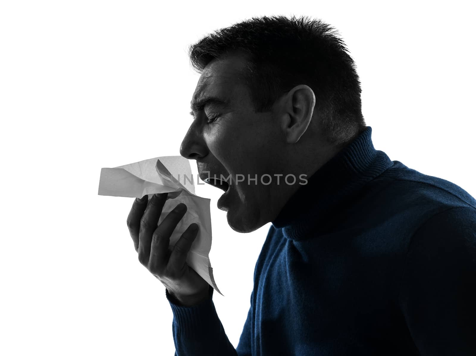 one caucasian man sneezing portrait in silhouette studio isolated on white background