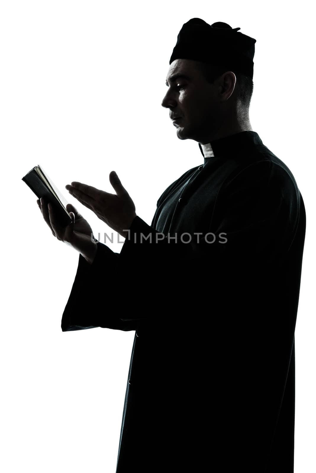 man priest silhouette reading bible by PIXSTILL
