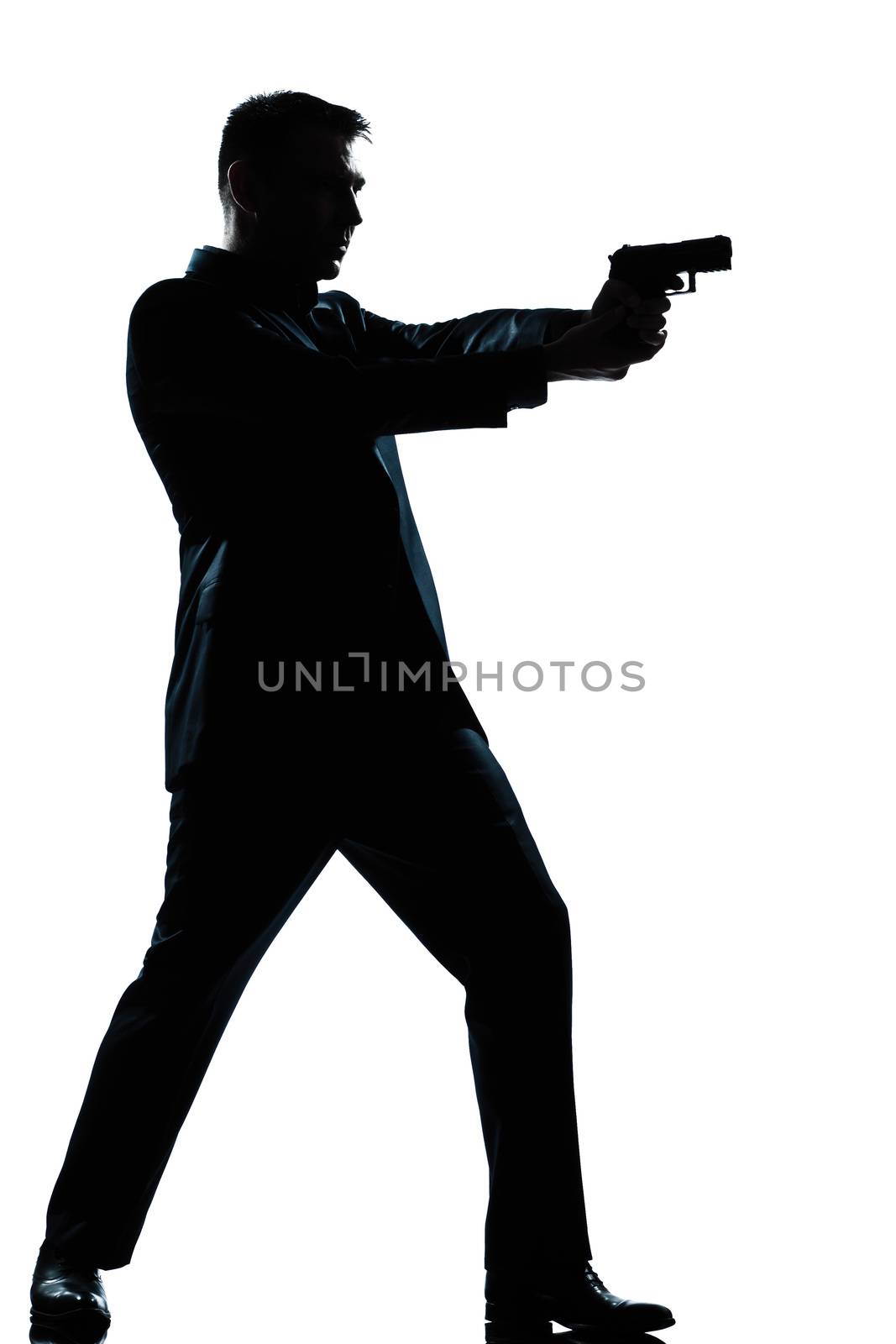 silhouette man full length shooting with gun by PIXSTILL