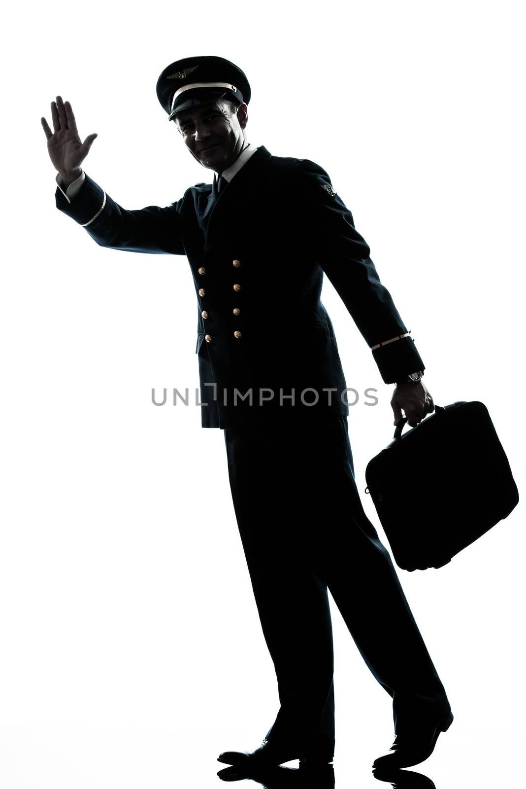 man in airline pilot uniform silhouette walking  by PIXSTILL