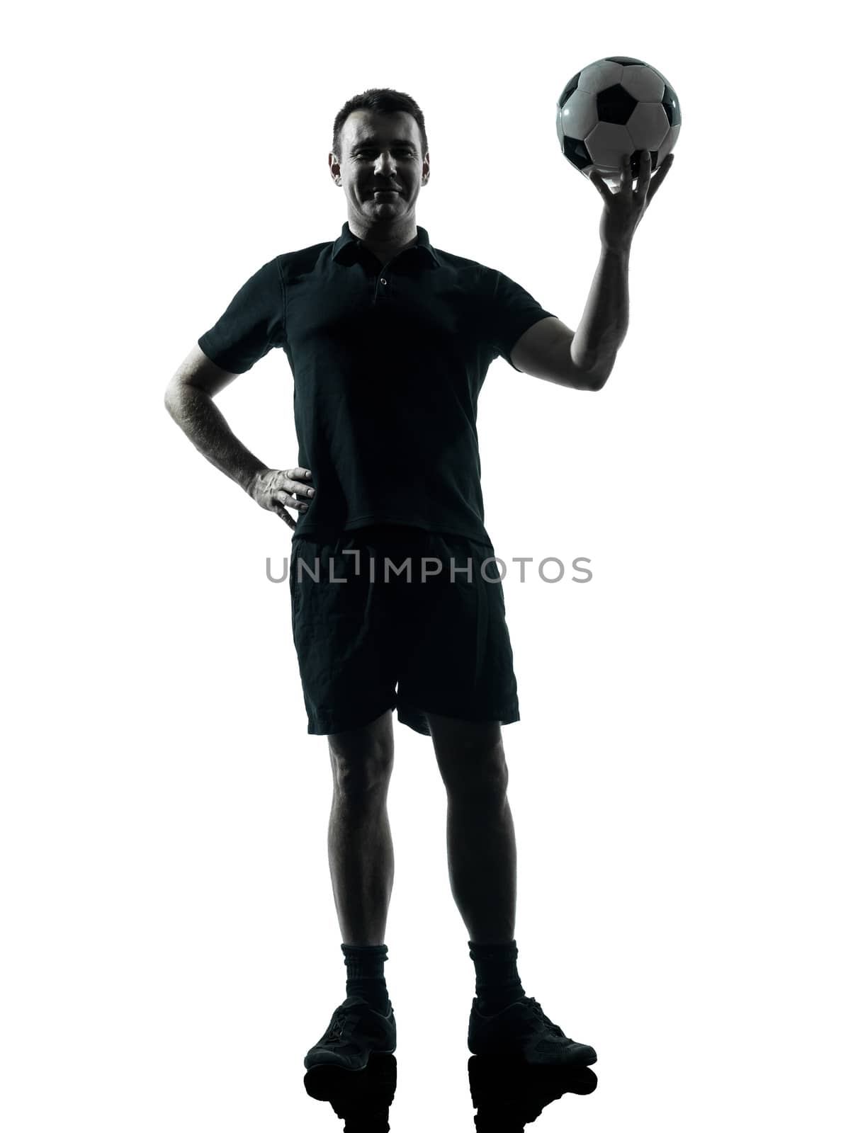 one man soccer player holding ball in studio silhouette isolated on white background