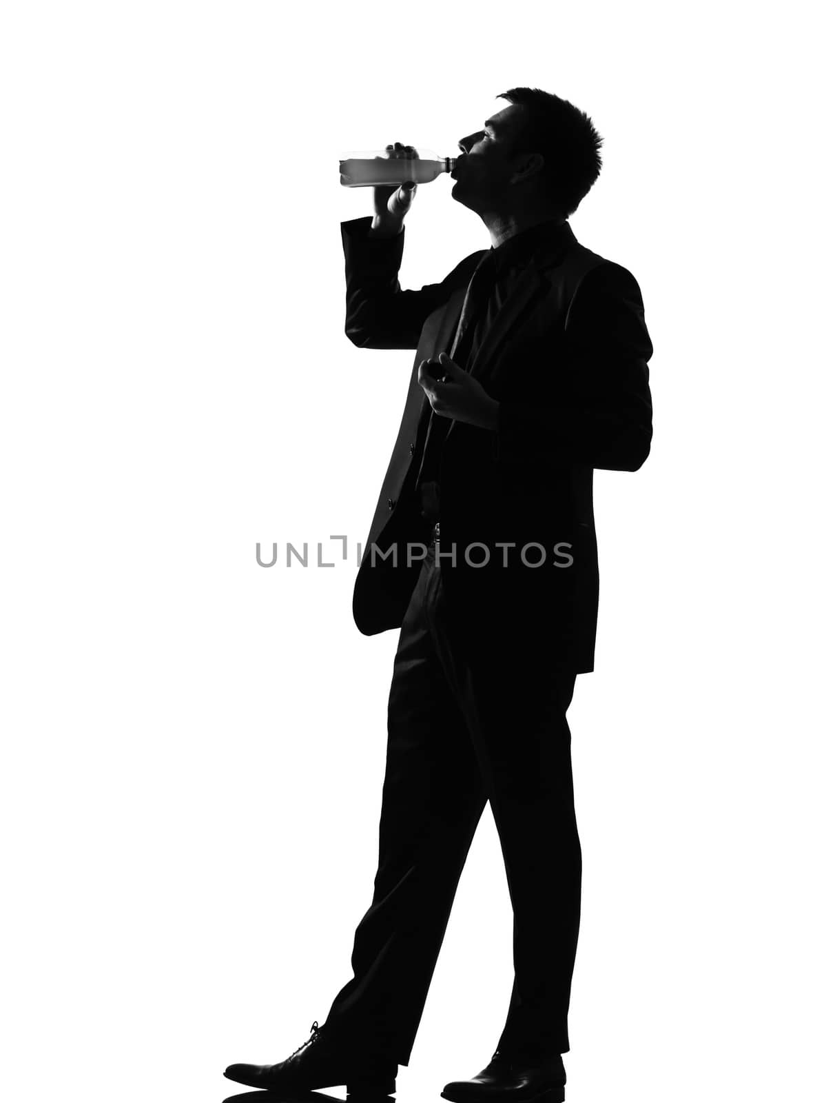 silhouette caucasian business man  expressing drinking behavior full length on studio isolated white background
