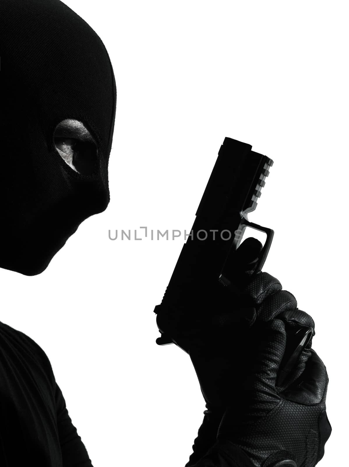 thief criminal terrorist holding gun portrait in silhouette studio isolated on white background