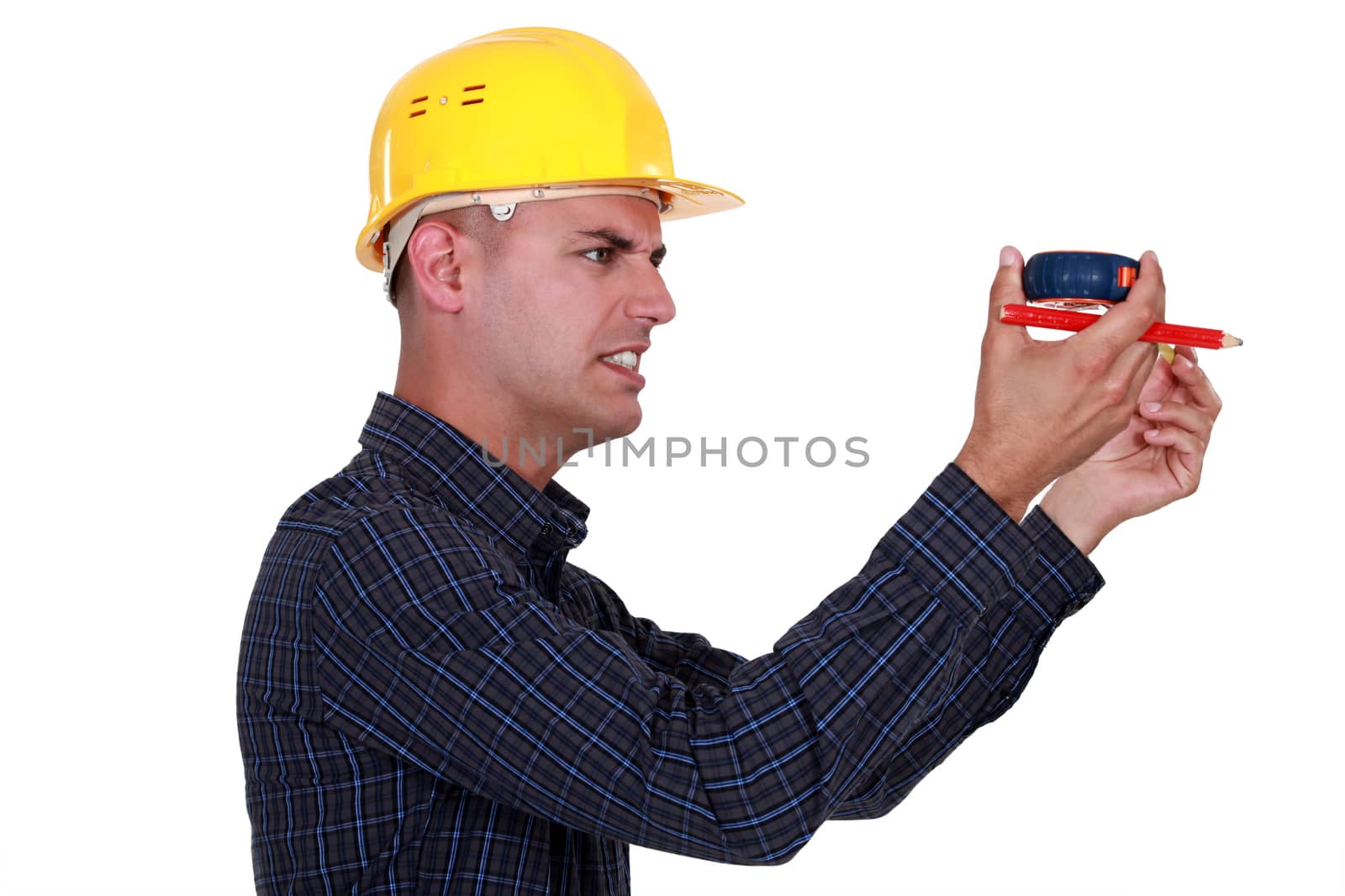 craftsman holding a meter and looking really displeased by phovoir