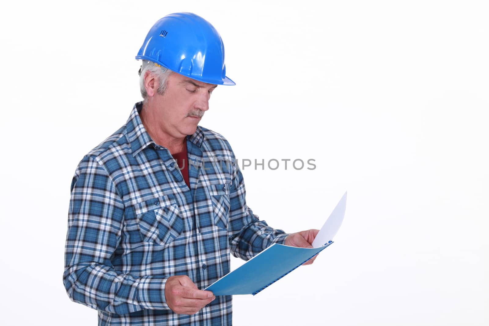 Engineer reading a report