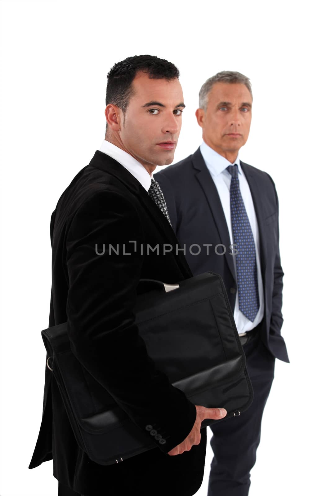 Two businessmen, studio shot by phovoir