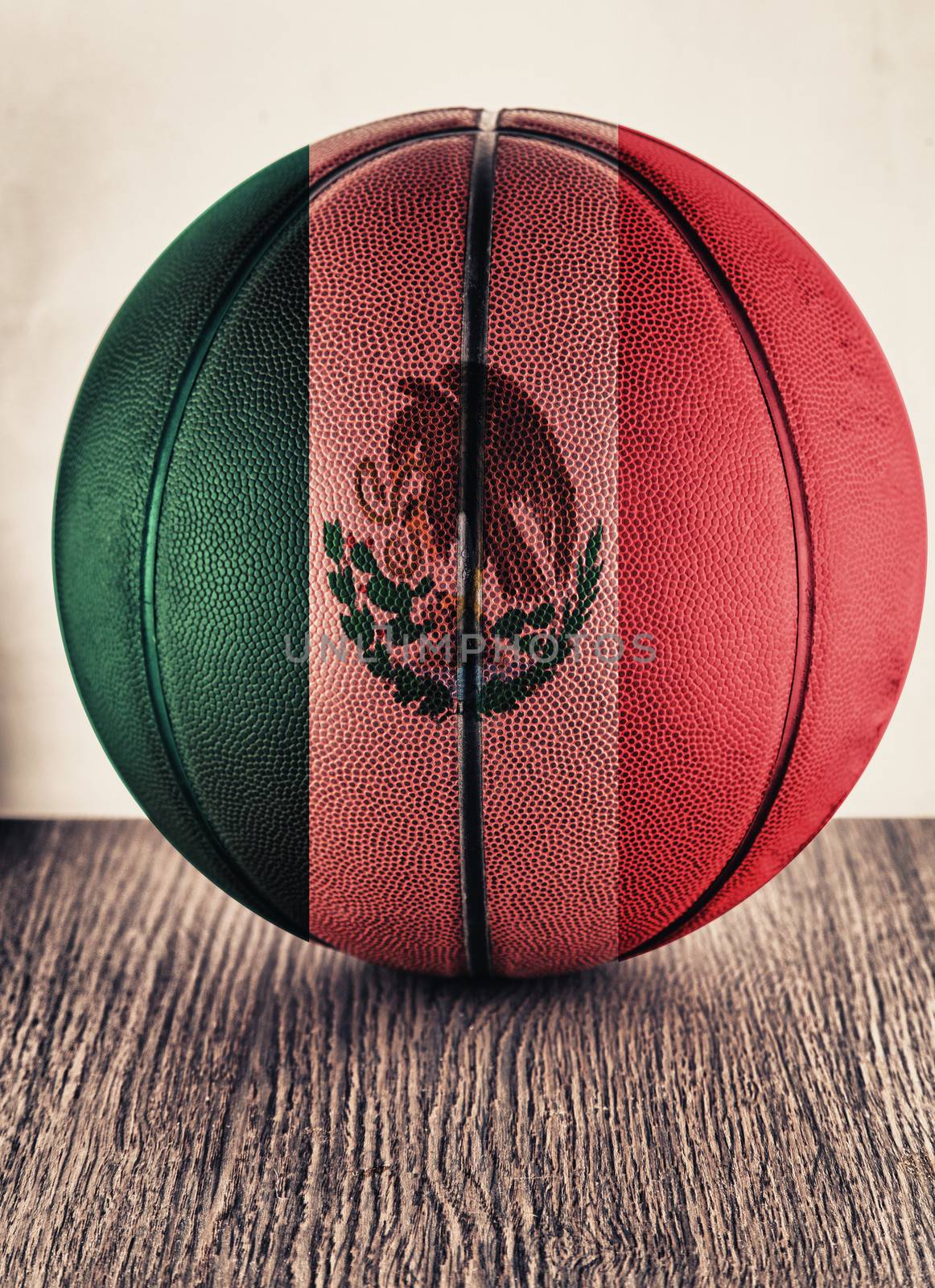 Close up of an old leather basketball with Mexico flag