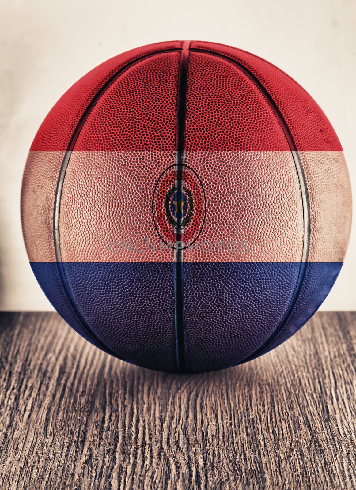 Close up of an old leather basketball with Paraguay flag