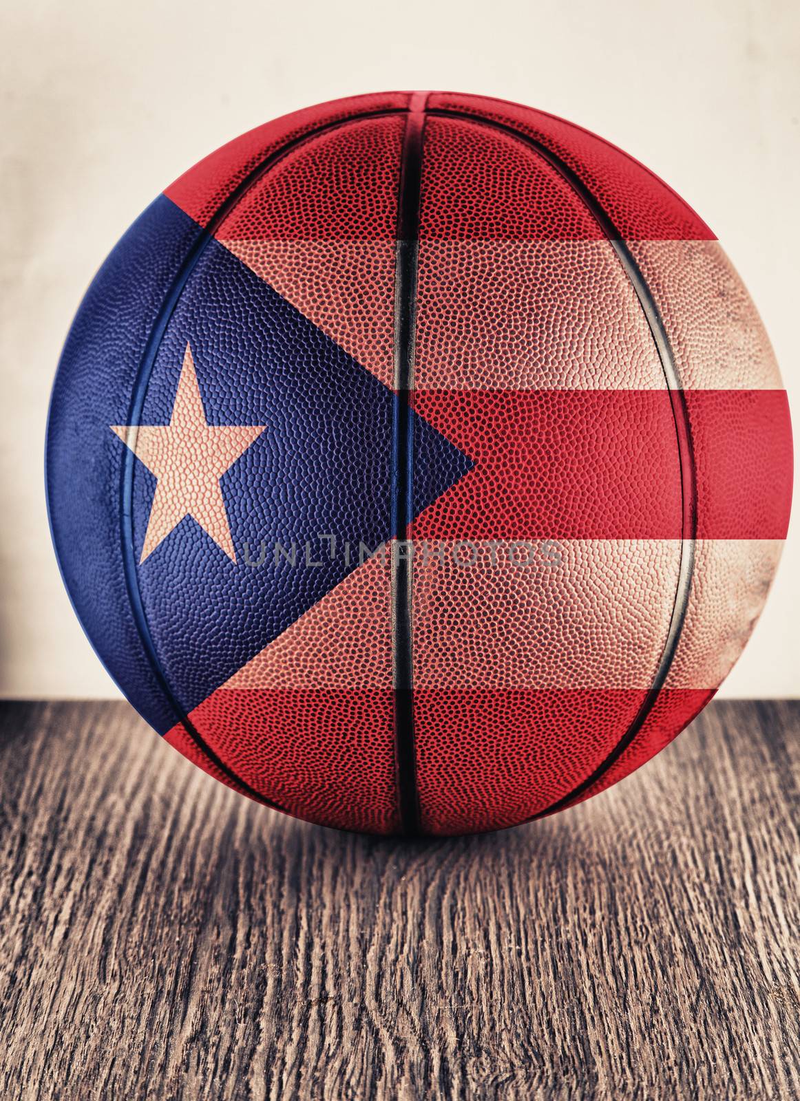 Close up of an old leather basketball with Puertorican flag