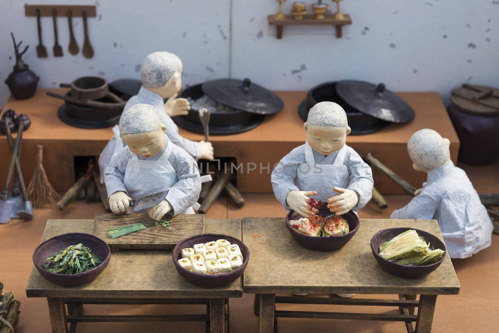 korean monk figures preparing traditional korean food