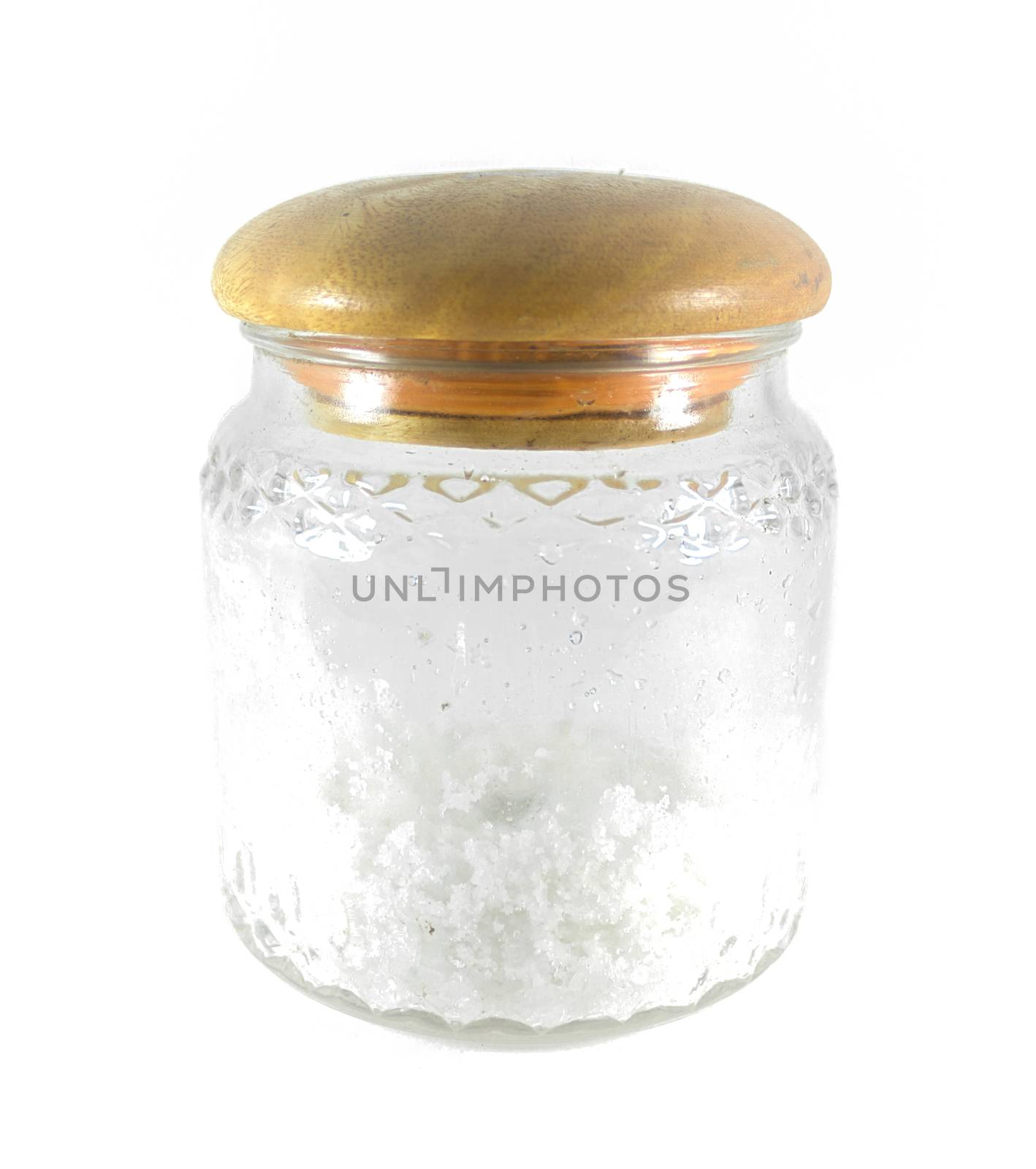 Salt in a glass jar with wood lid isolated