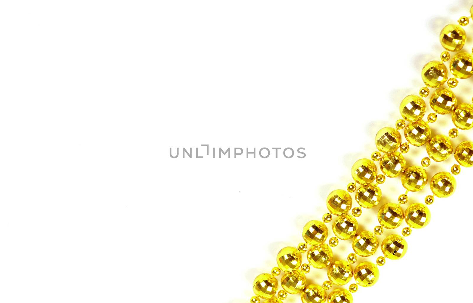 Background made of a brilliant celebratory beads of golden color