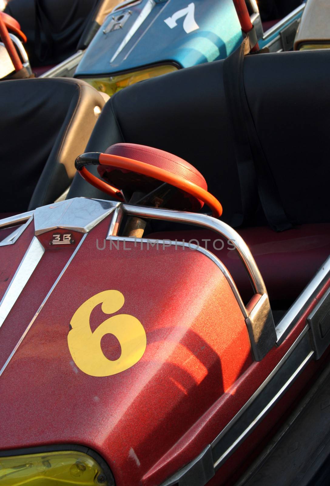 Colorful electric cars in amusement park