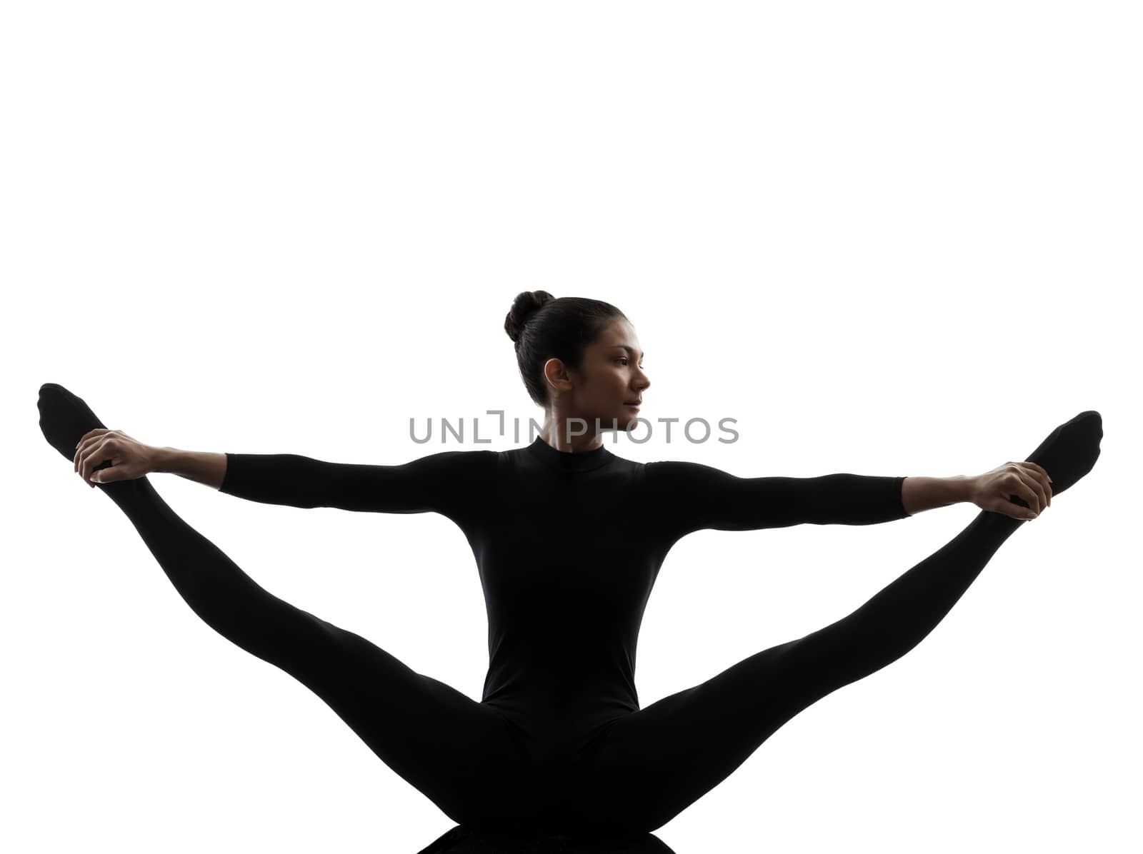woman exercising gymnastic yoga  stretching split  silhouette by PIXSTILL