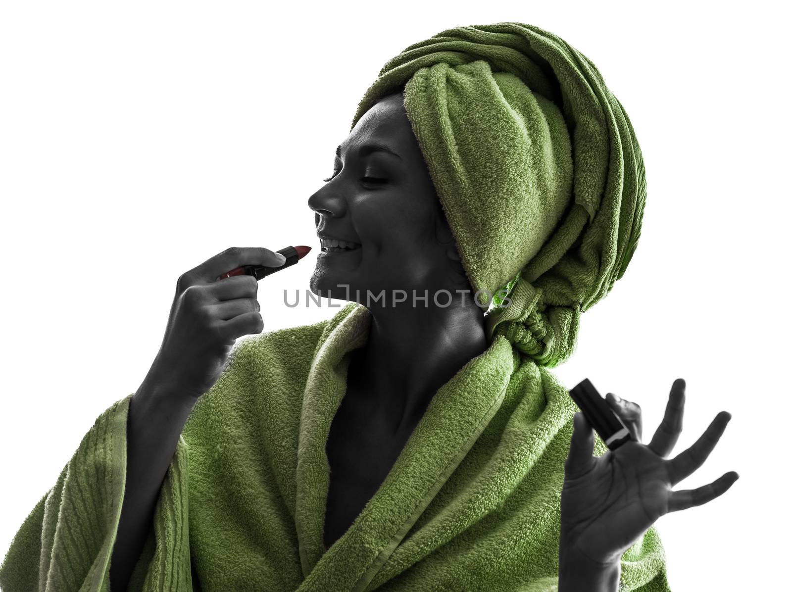 one  woman applying lipstick  in silhouette  on white background