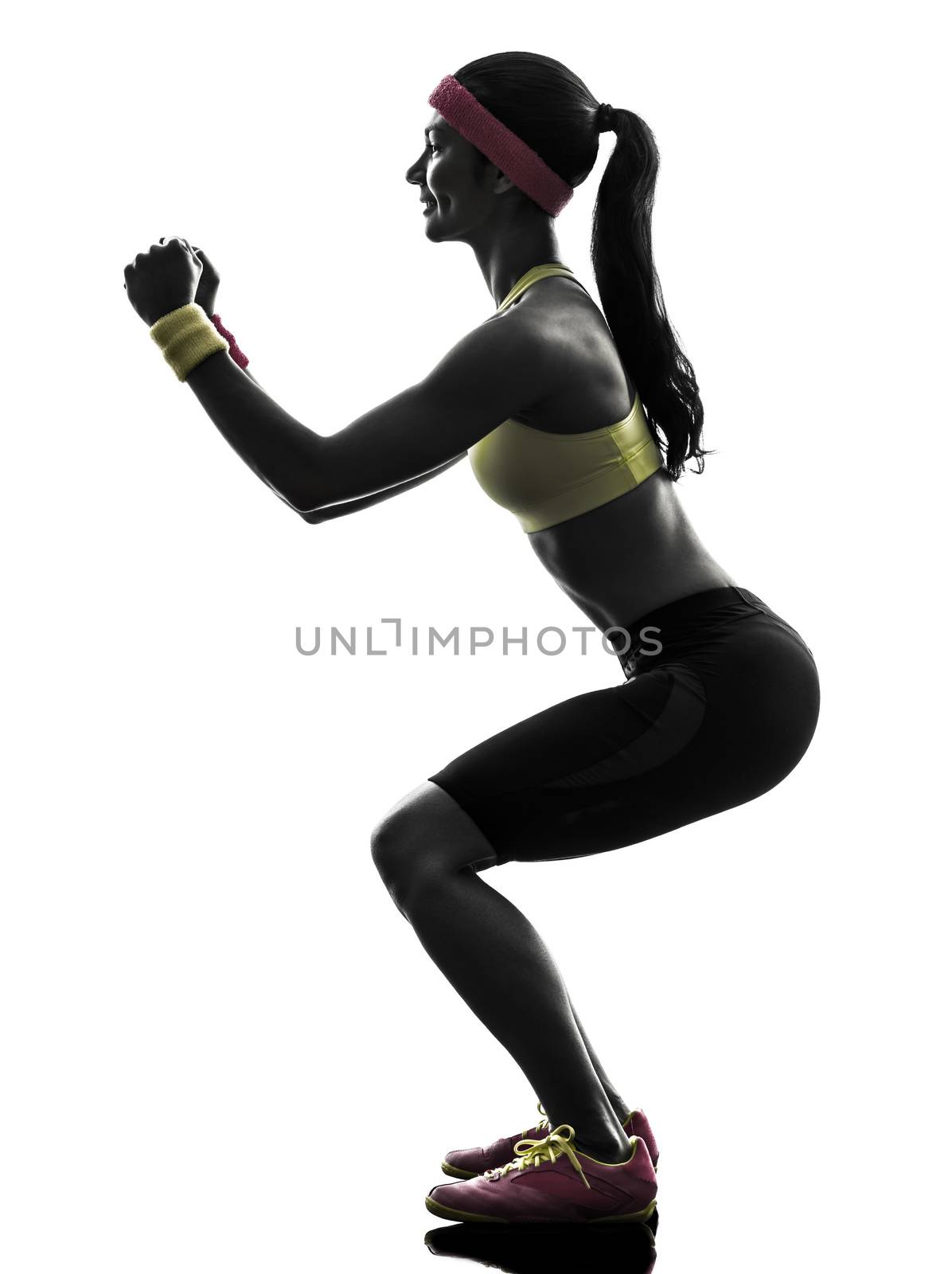 one  woman exercising fitness workout lunges crouching  in silhouette  on white background