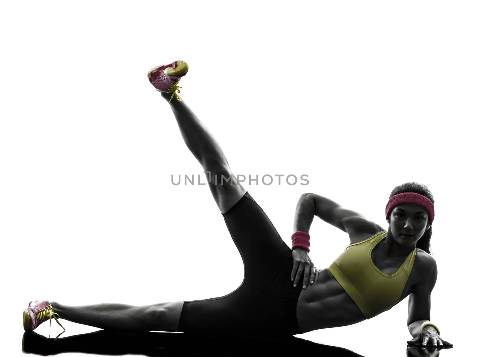 woman exercising fitness workout  feet up silhouette by PIXSTILL