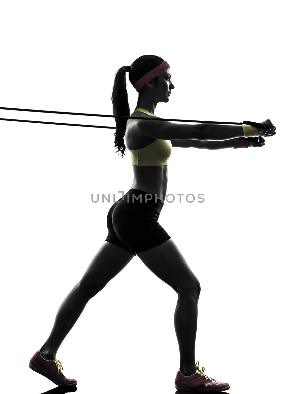 one  woman exercising fitness workout resistance bands in silhouette  on white background