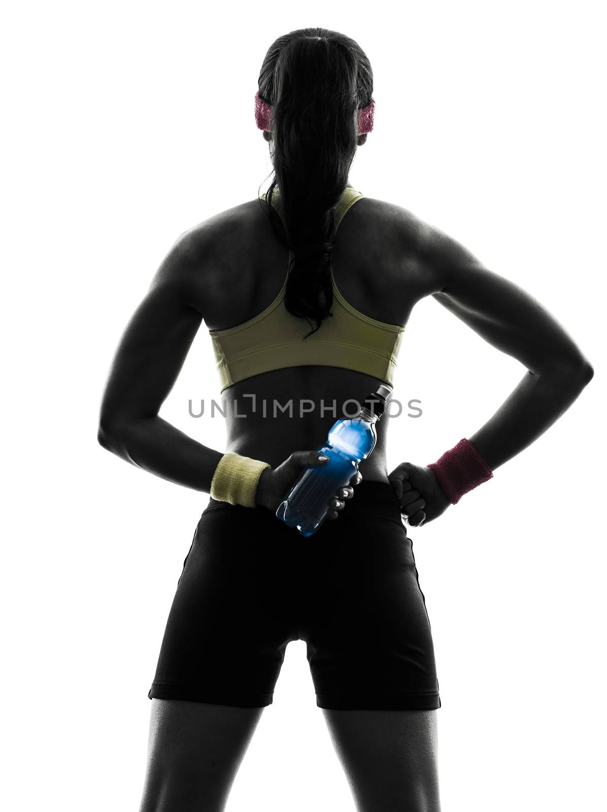woman exercising fitness holding energy drink  rear view silhoue by PIXSTILL