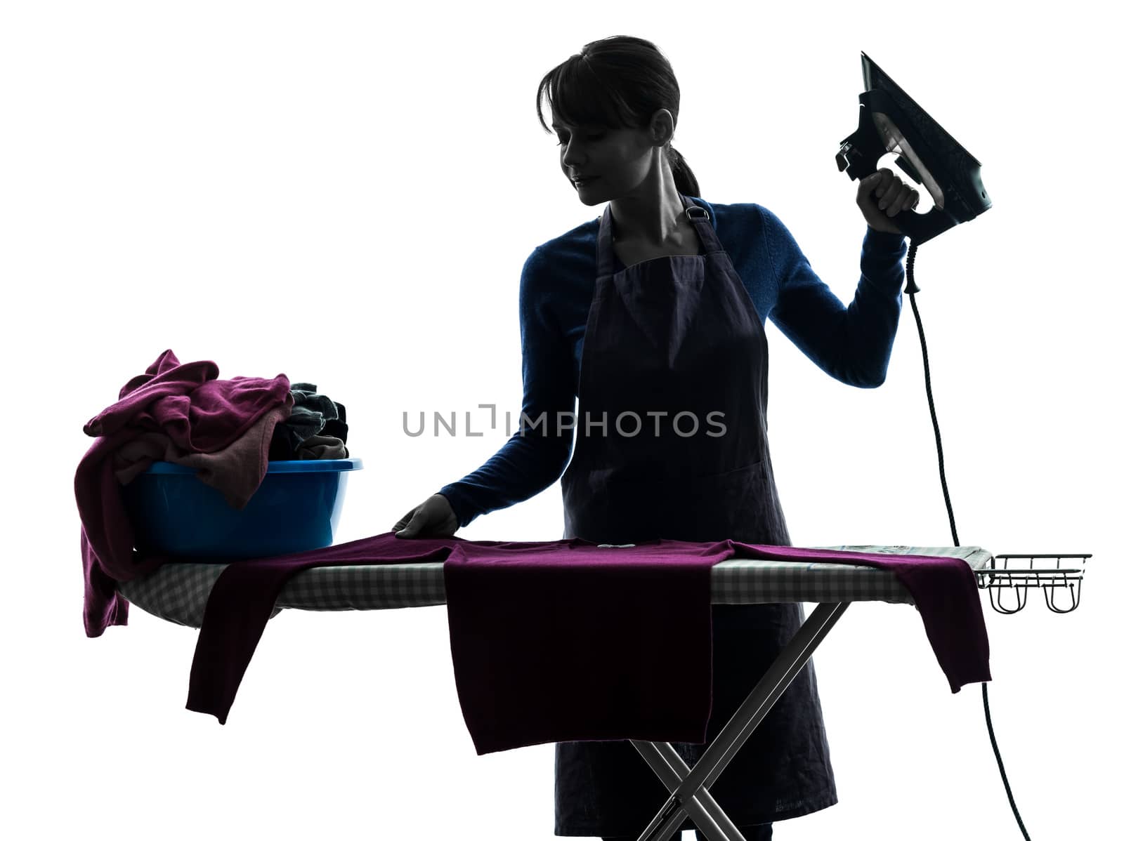 one caucasian woman maid cleaning ironing in silhouette studio isolated on white background