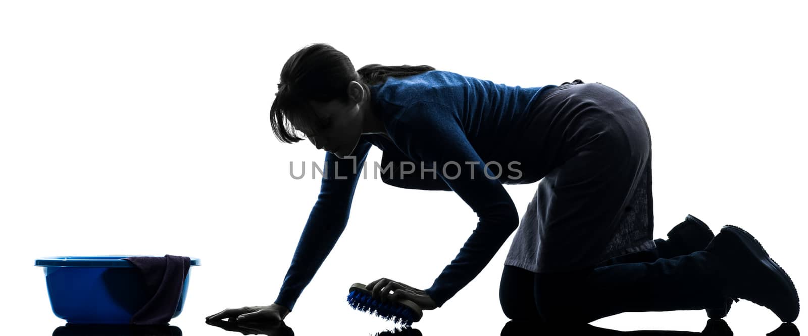 one caucasian woman maid cleaning washing floor   in silhouette studio isolated on white background