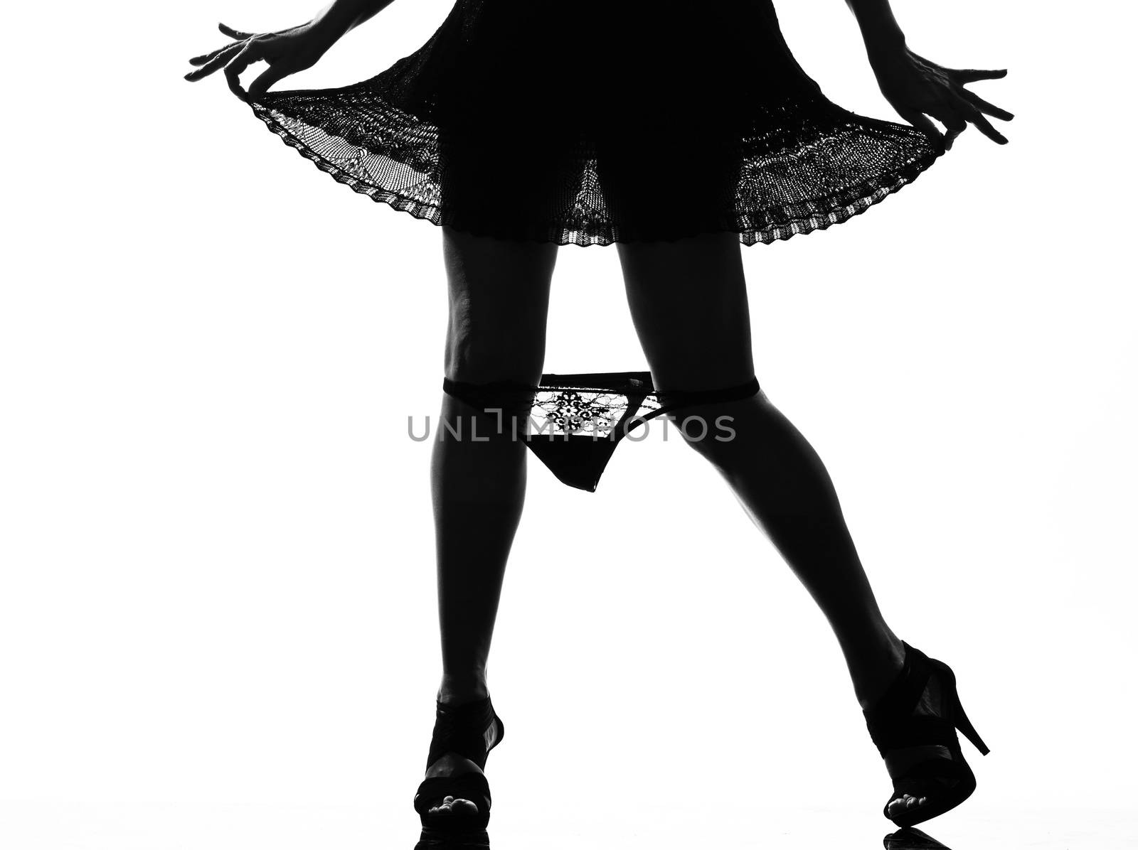 stylish silhouette woman legs loosing her underwear by PIXSTILL