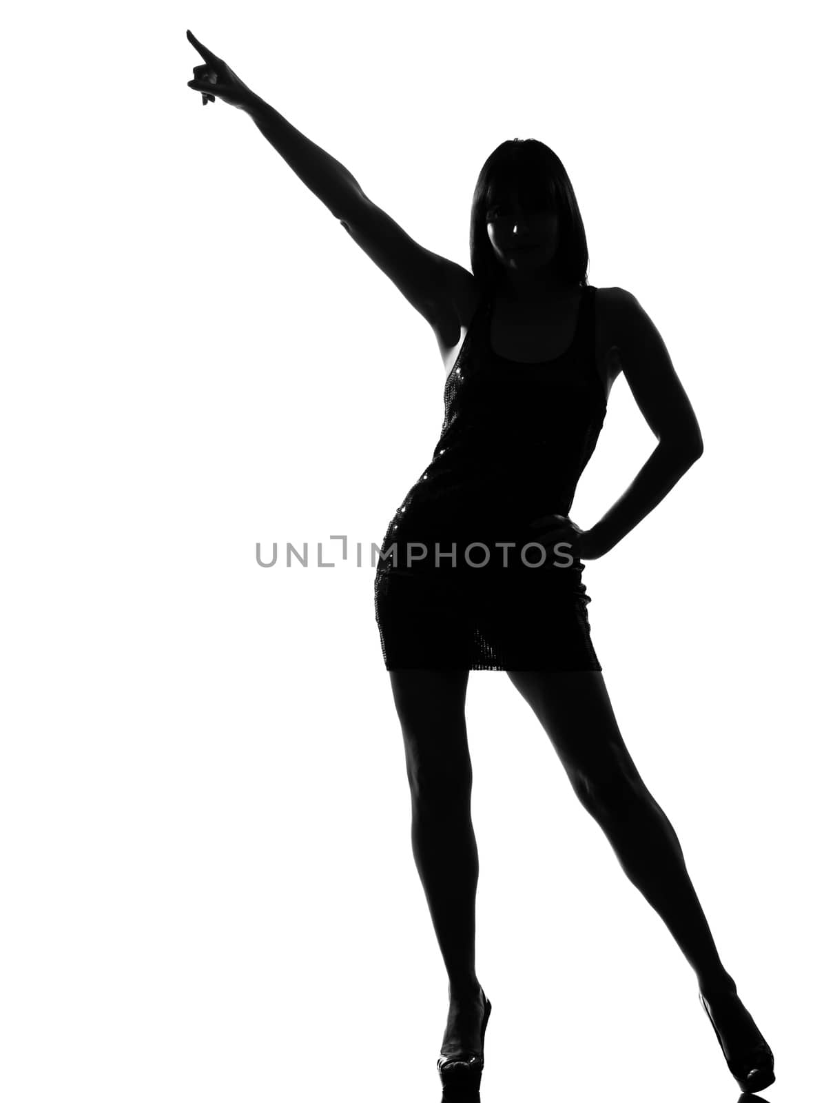 stylish silhouette caucasian beautiful woman dancing posture pointing full length on studio isolated white background