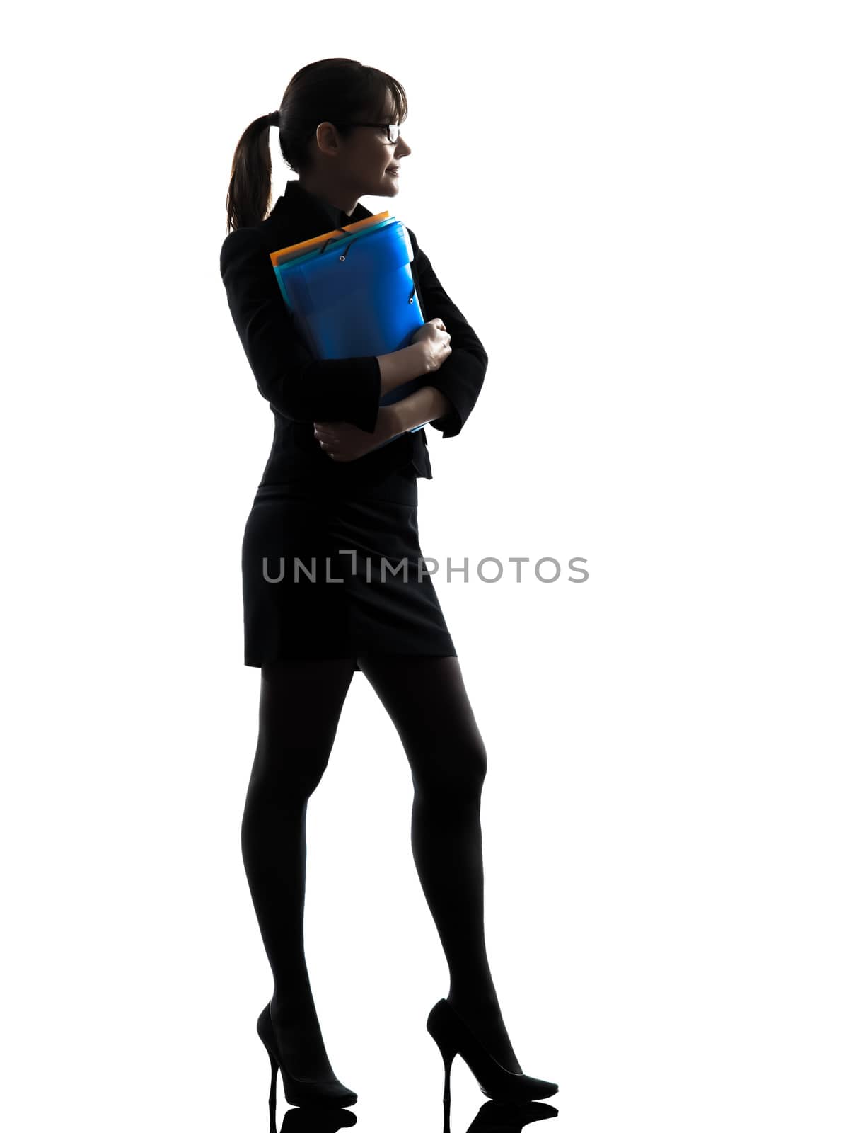 one business woman holding folders files standing  silhouette studio isolated on white background