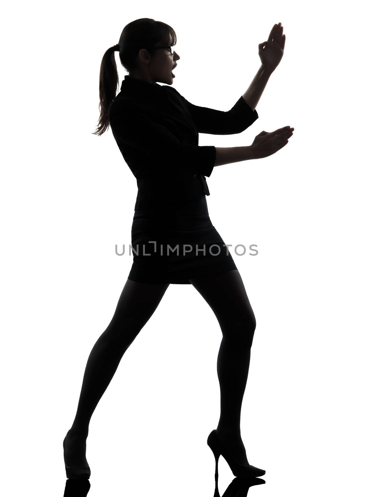 one business woman karate self defense  silhouette studio isolated on white background