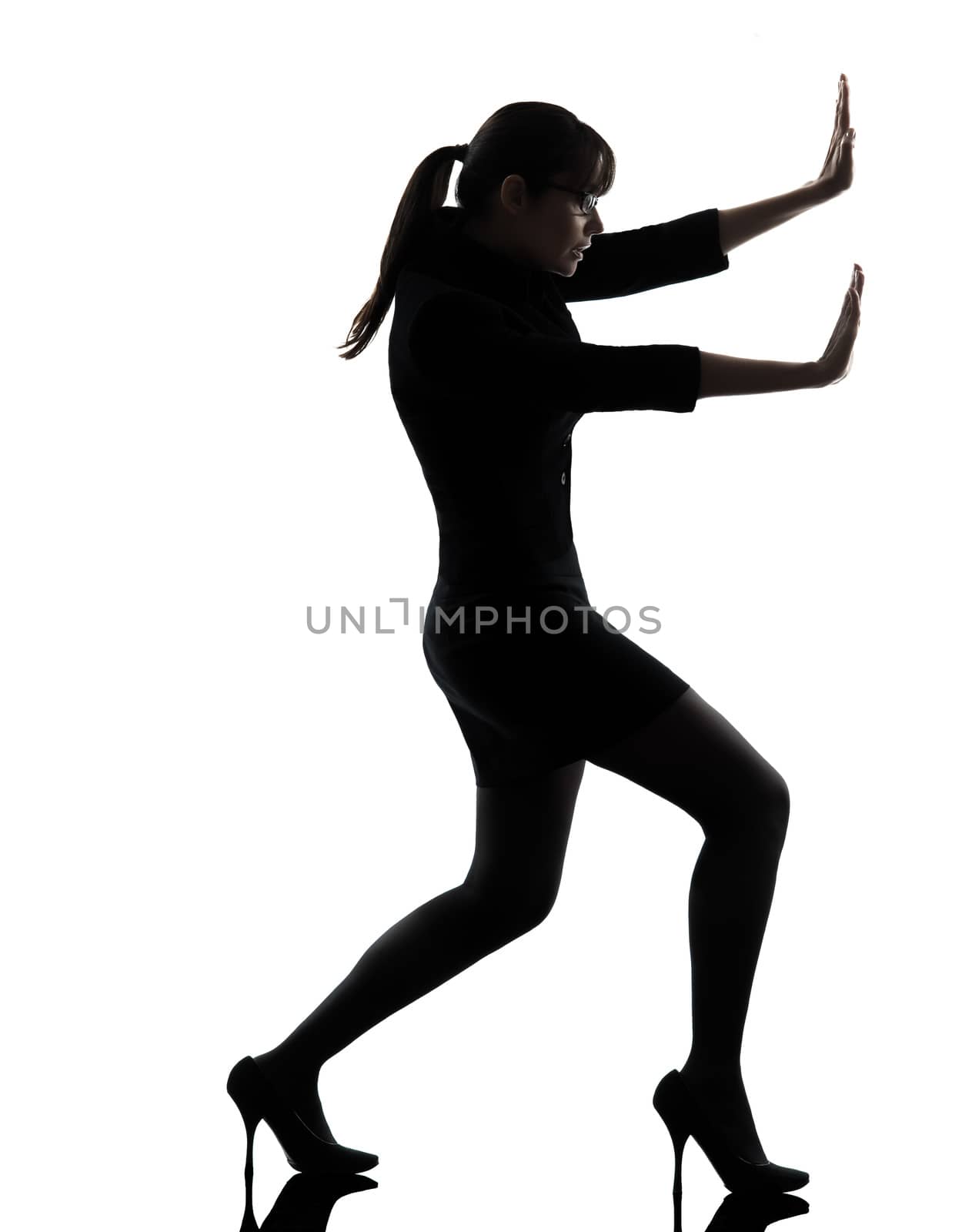 business woman pushing silhouette by PIXSTILL