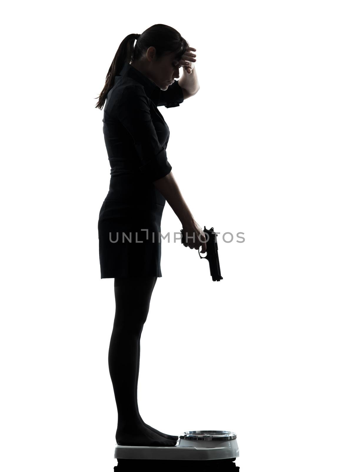 one woman standing on weight scale despair aiming gun silhouette studio isolated on white background