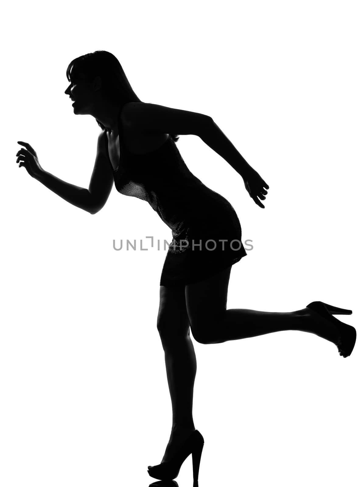 stylish silhouette caucasian beautiful woman running happy  full length on studio isolated white background