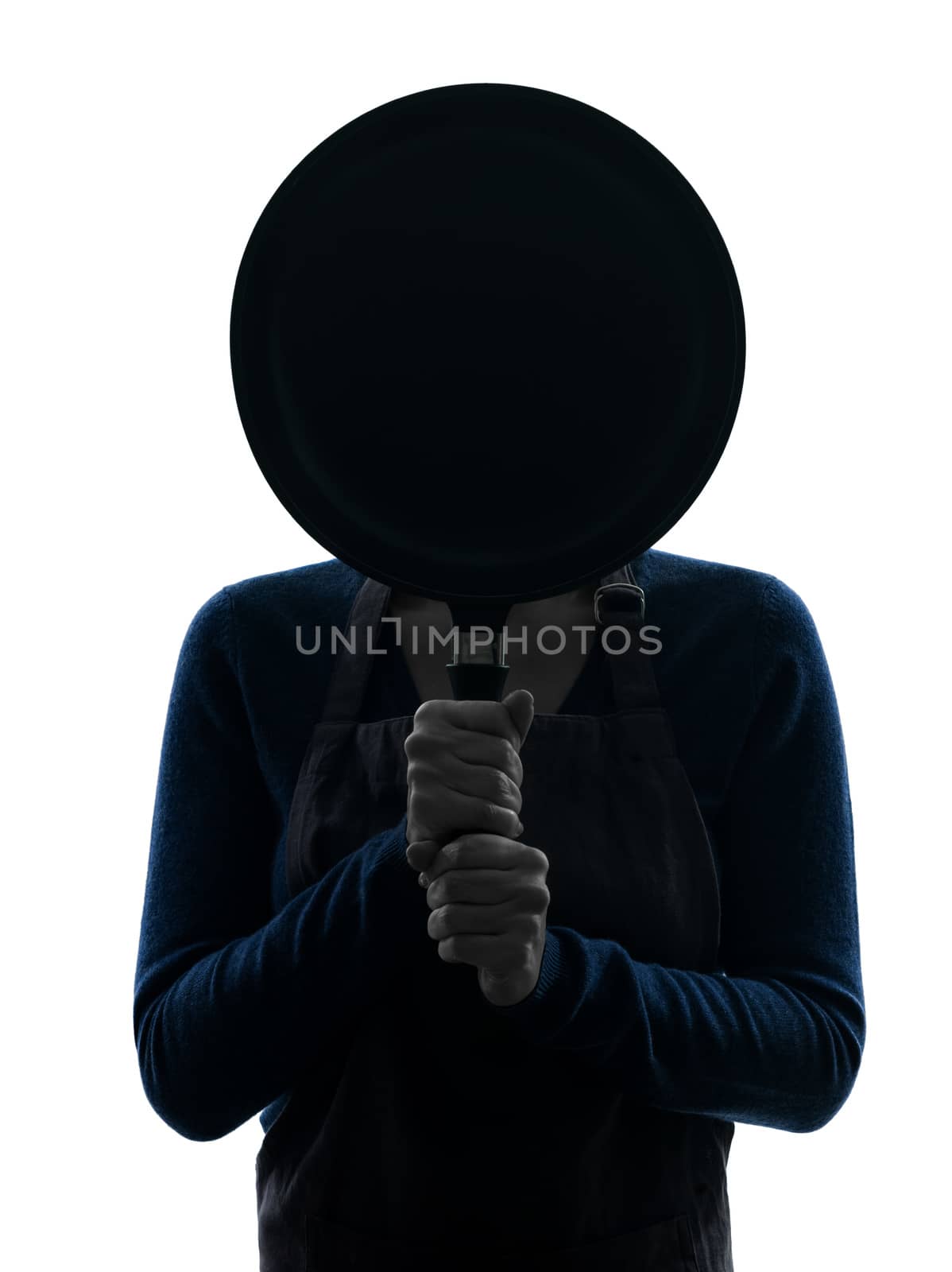 one caucasian woman cooking  hiding behind frying pan  in silhouette studio isolated on white background