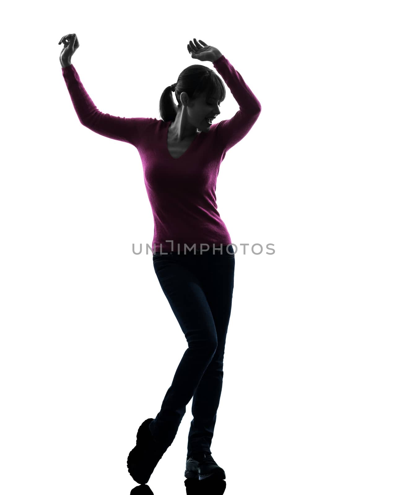 one caucasian woman happy dancing  in silhouette studio isolated on white background