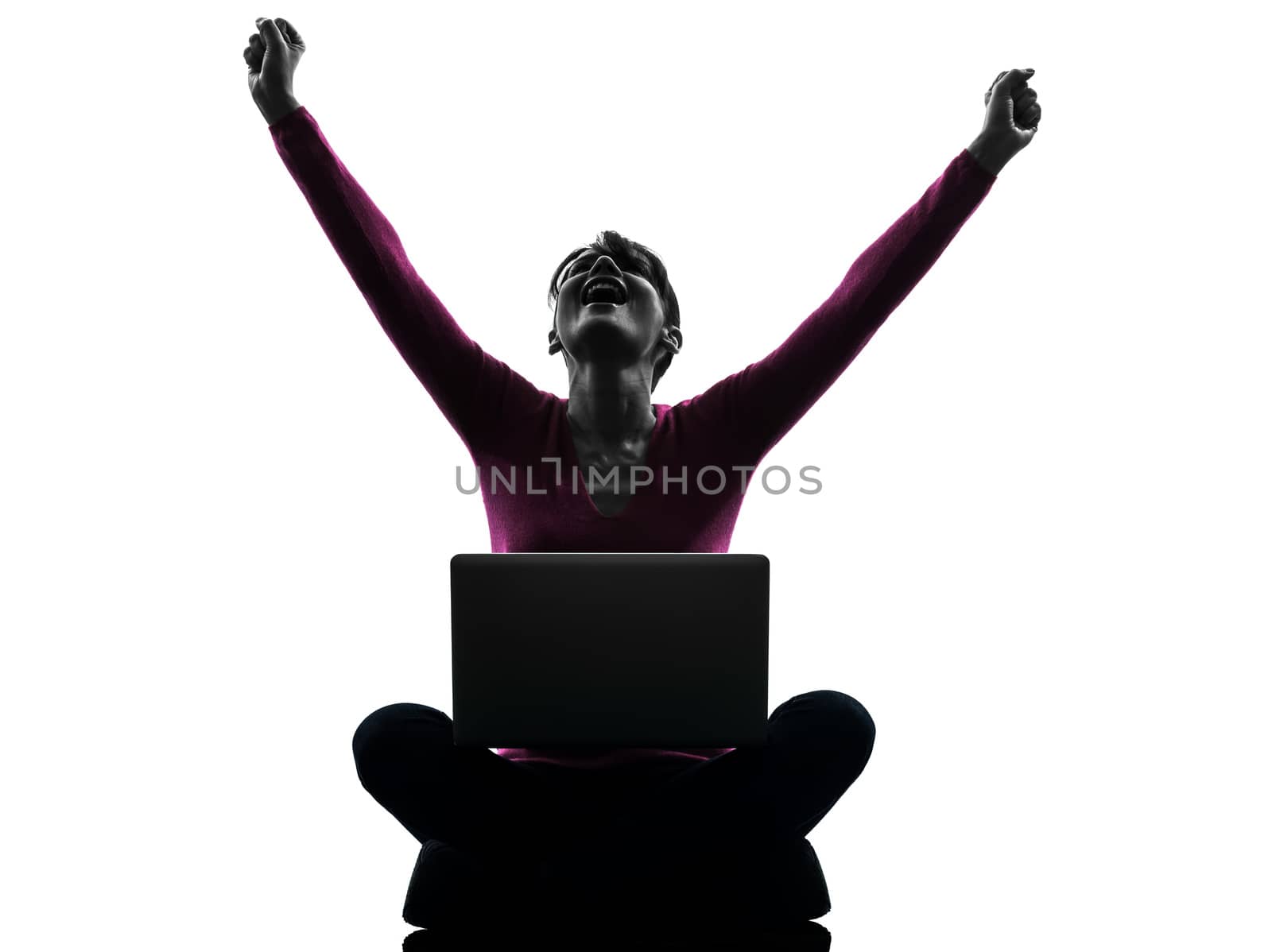 one caucasian woman happy winning  computing laptop computer  in silhouette studio isolated on white background