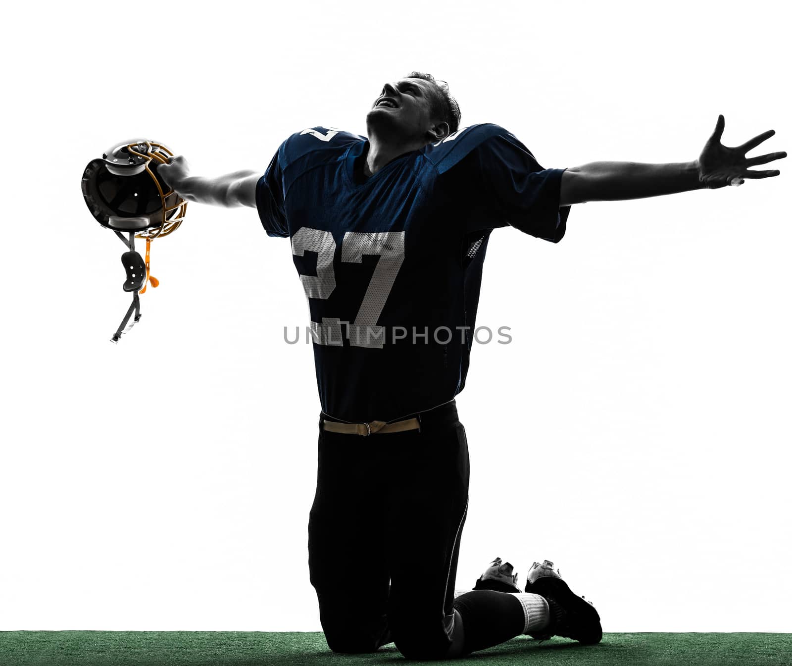 one caucasian american football player man triumphant in silhouette studio isolated on white background